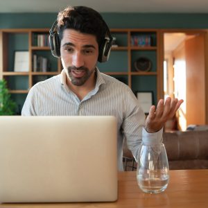 portrait young man work video call with laptop from home home office concept new normal lifestyle 58466 15800